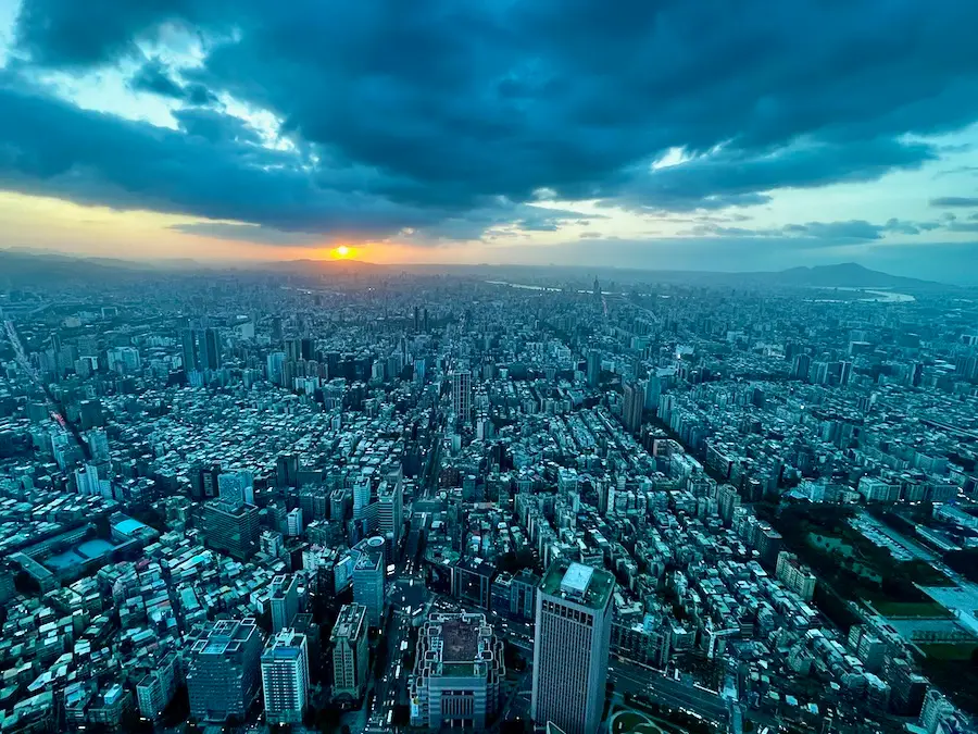 A sky-view of Taipei the city while the sunset sets in the horizon.