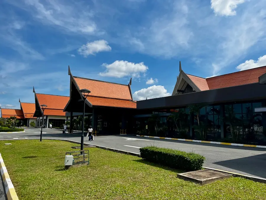 A building with simple, but decorative orange roofs.