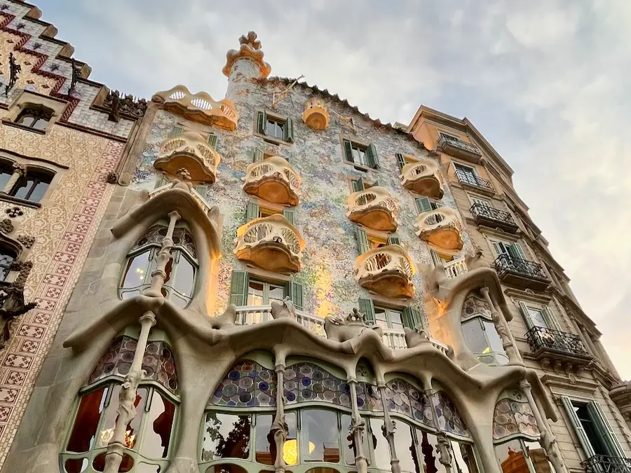 A flat building with elaborate and eccentric decorations and balconies.