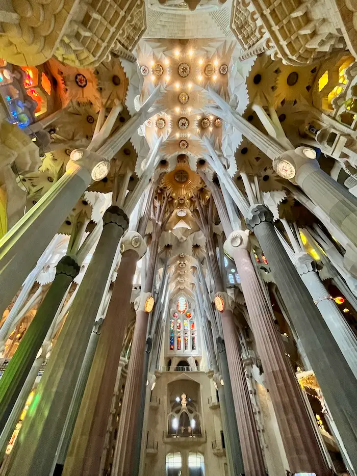 A cathedral's interior rooftop with eccentric and very detailed carvings and decorations.