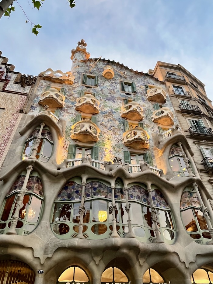 The exterior of an intricately decorated building with balconies.