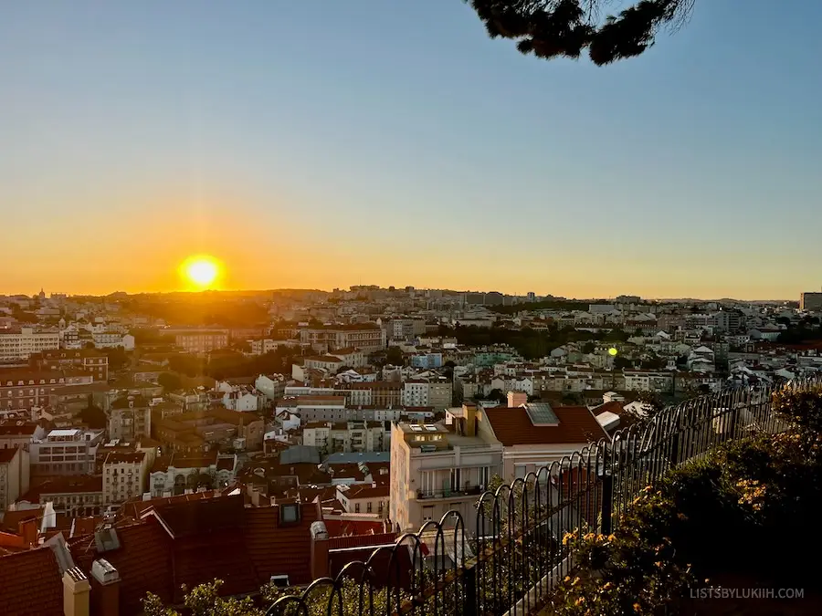 The sun setting over an European skyline.