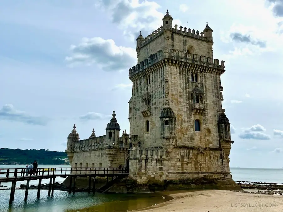 An old and worn tower near the beach.