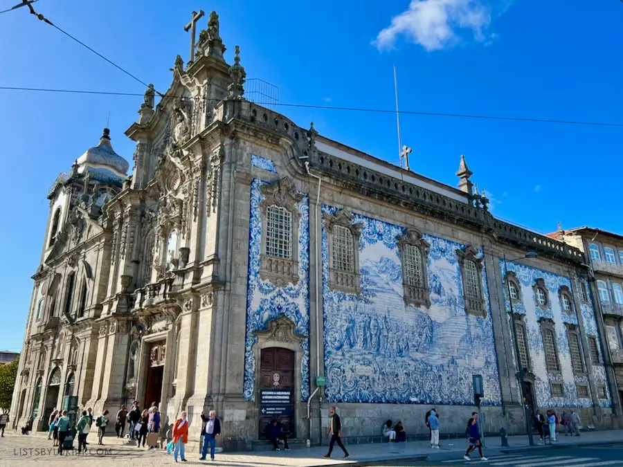 An old church decorated with blue, ceramic tiles on its facade.