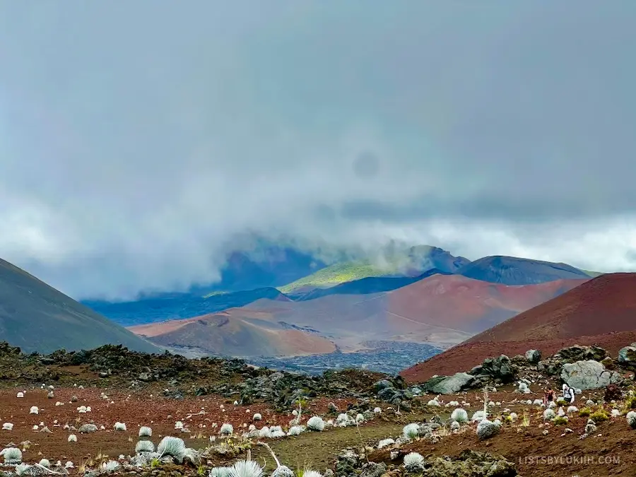 A volcanic scenery showing different colored mountains.