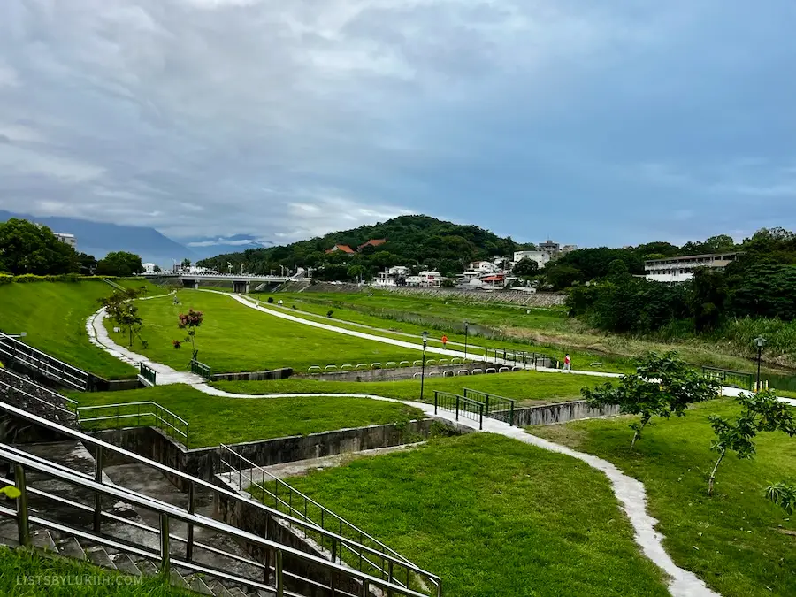 A view of a small town with a large park.