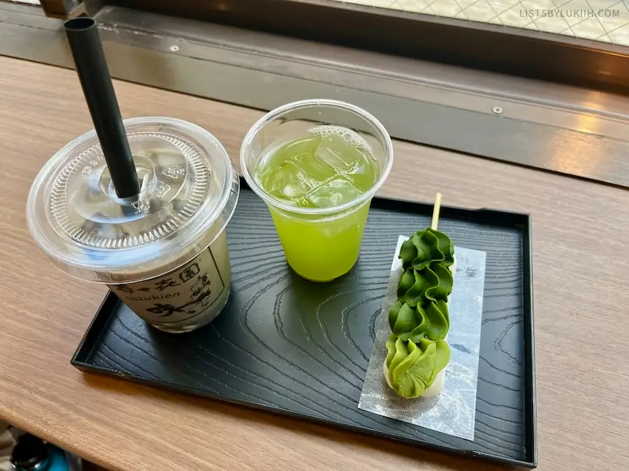 Green tea next to green bean paste on top of mochi balls.