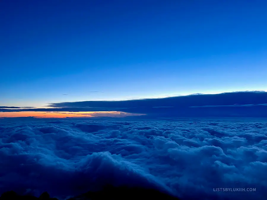 A view of the sunrise above the clouds.