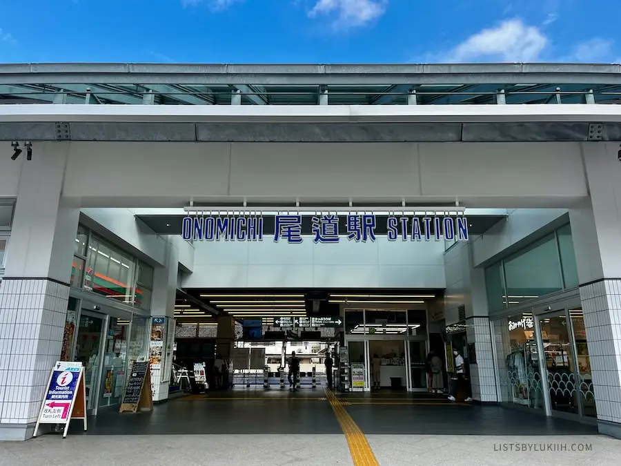 A train station that has the sign that says "Onomichi" on it.