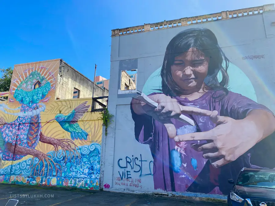 Two art murals featuring a mythical animal and a realistic girl.