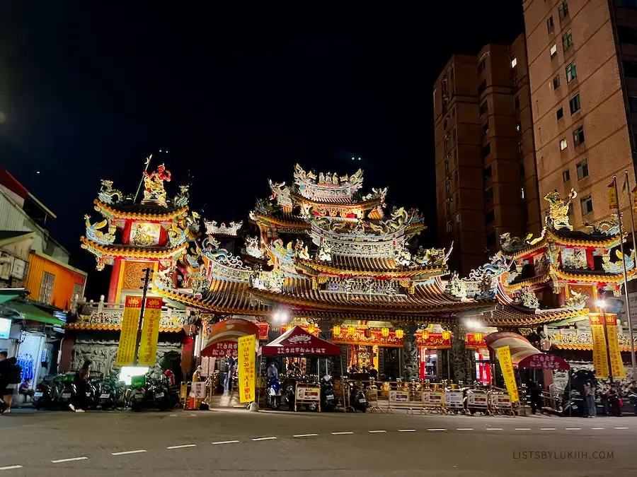 A well-lit Asian temple at night.