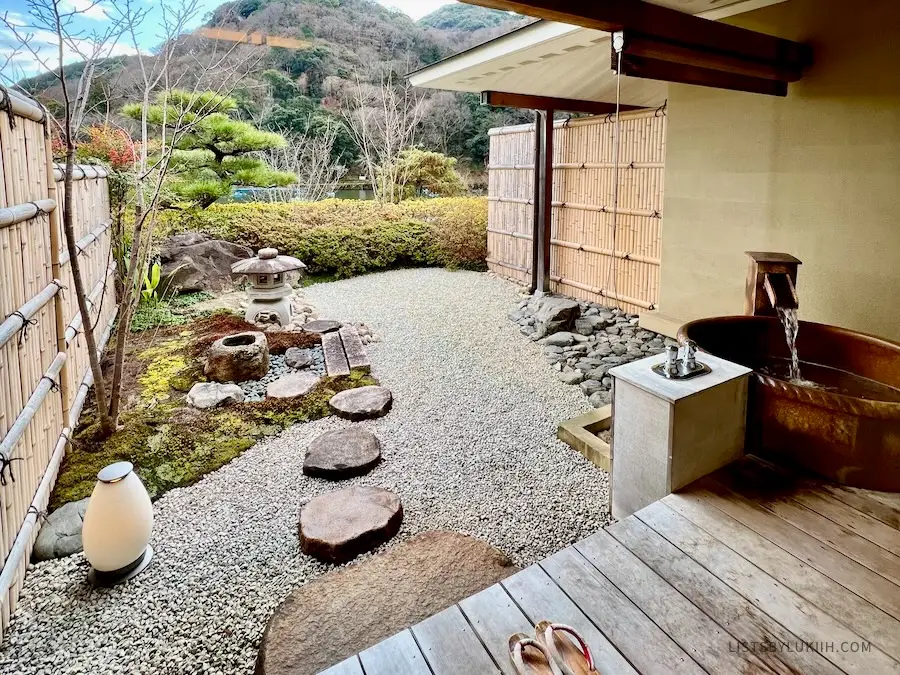 A view of a peaceful, Japanese garden with a private bath.