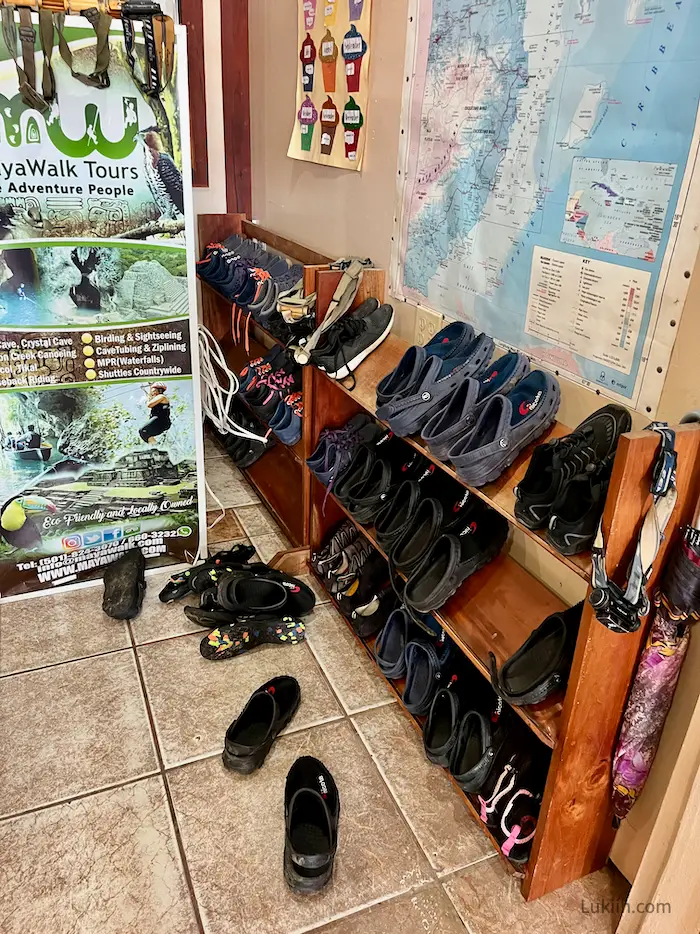 A shelf with different types of water shoes.