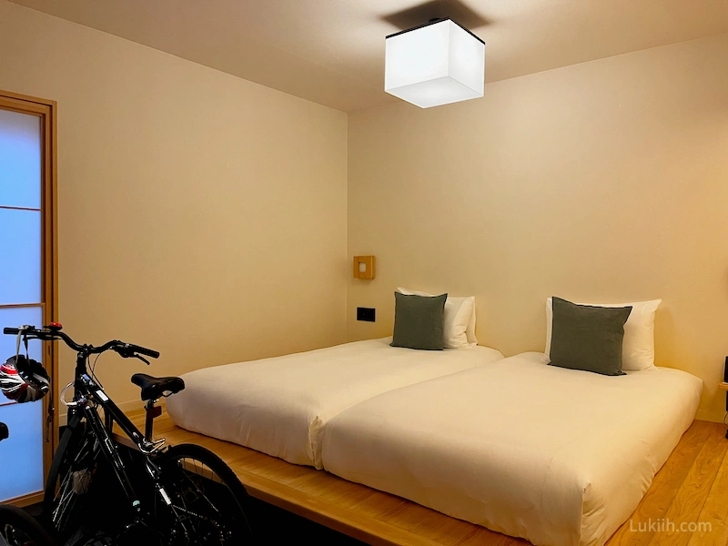 A traditional room in a Japanese hotel with a space for bike.