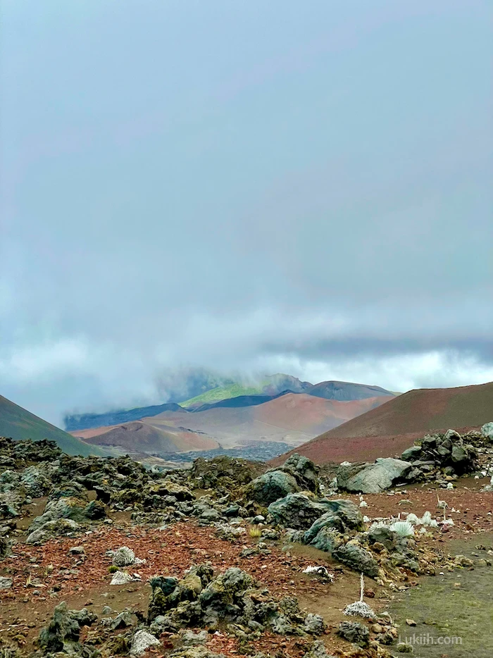 A volcanic scenery showing different colored mountains.