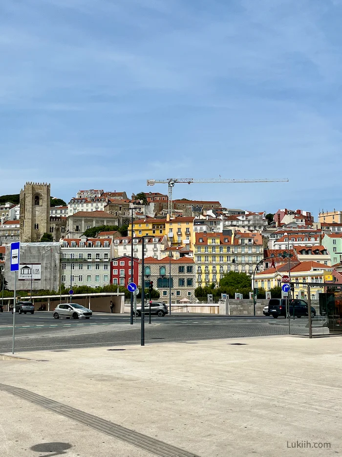 A street with colorful buildings in the background.