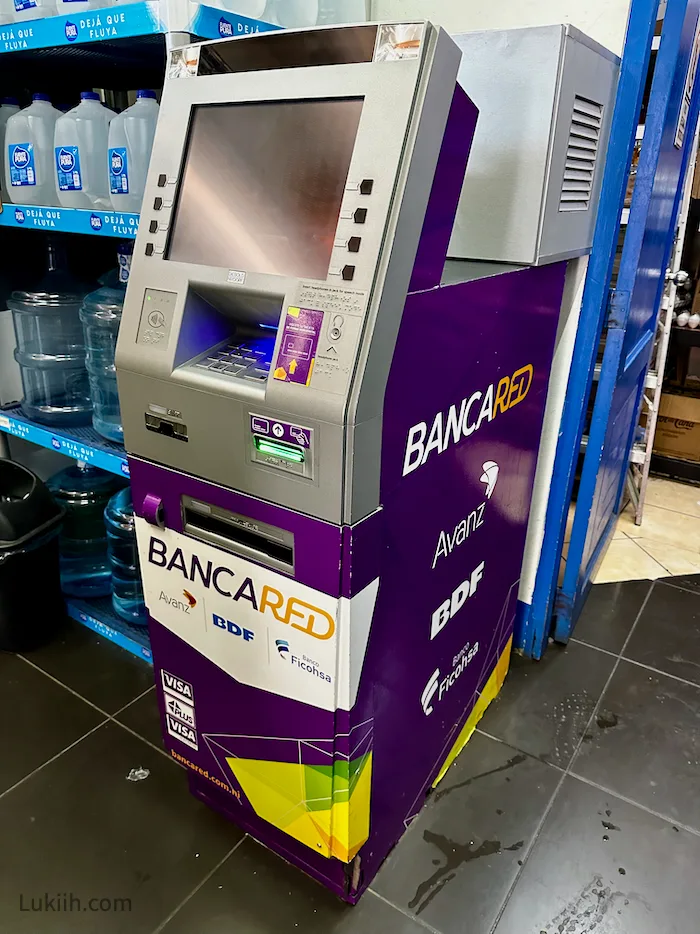 Purple ATM machine that says BANCARED.