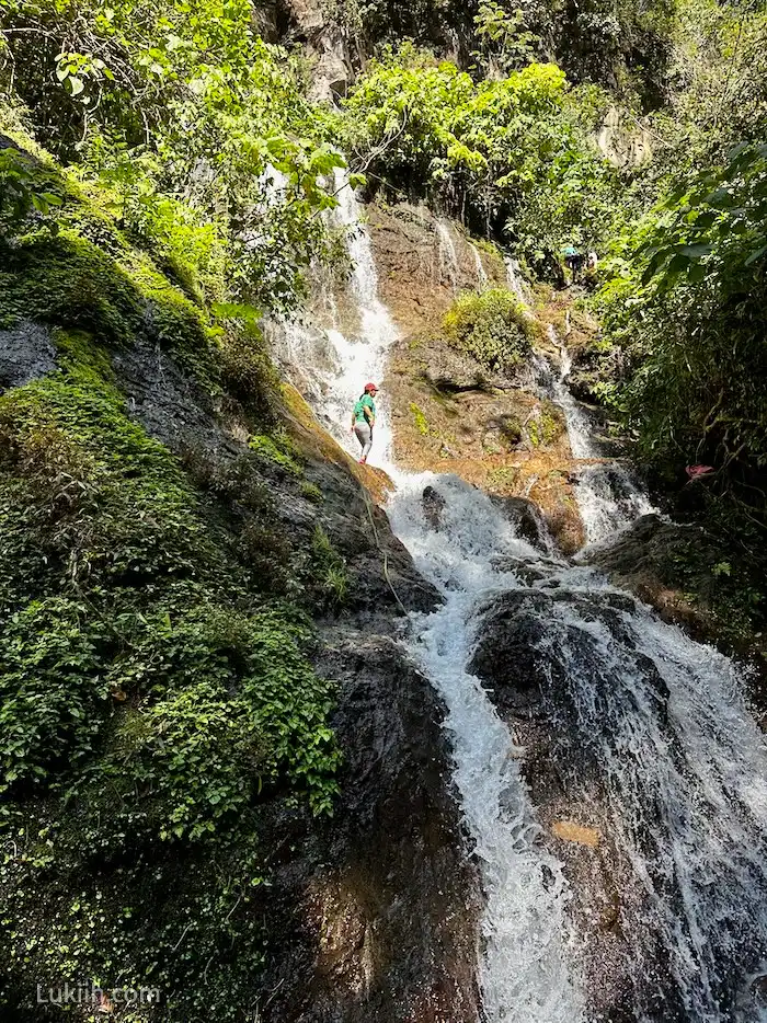 A person standing on a waterfall