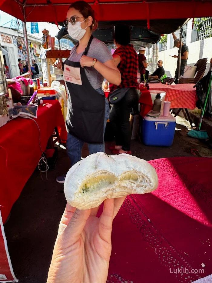 A steamed bun with cheese inside.