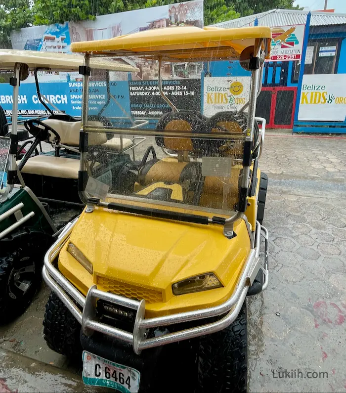 A golf cart in the rain.