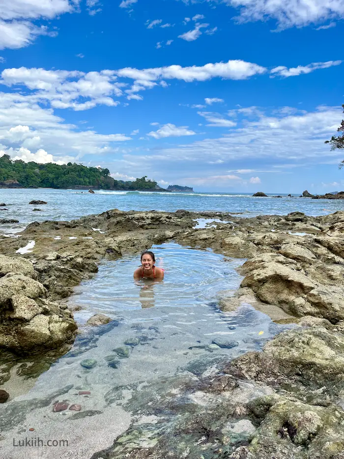 A woman enjoying a dip at a natural tide pool