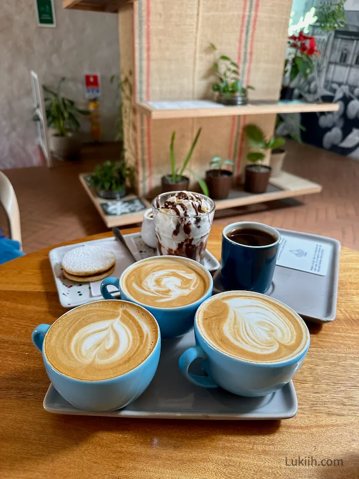 Several cups off latte with latte art.