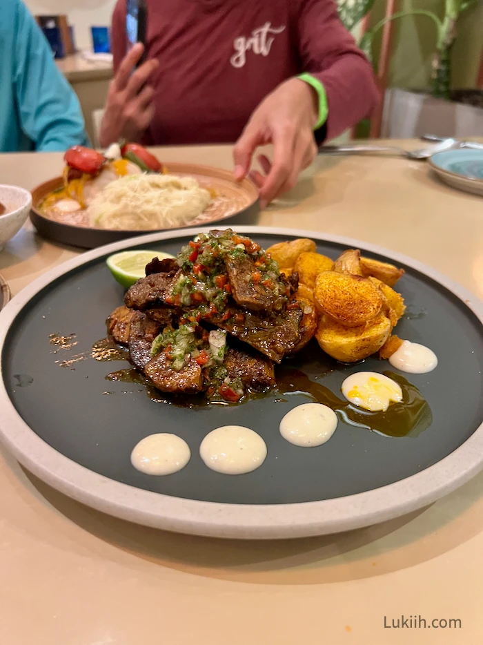 A fancy plate of beef with potatoes.