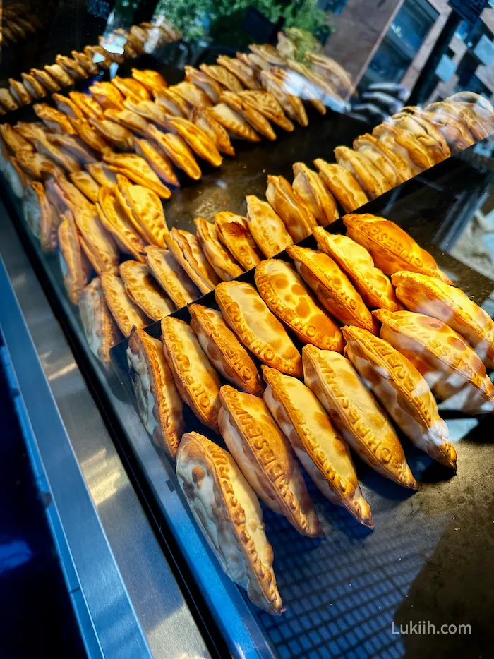 A food vendor with lots of empanadas.