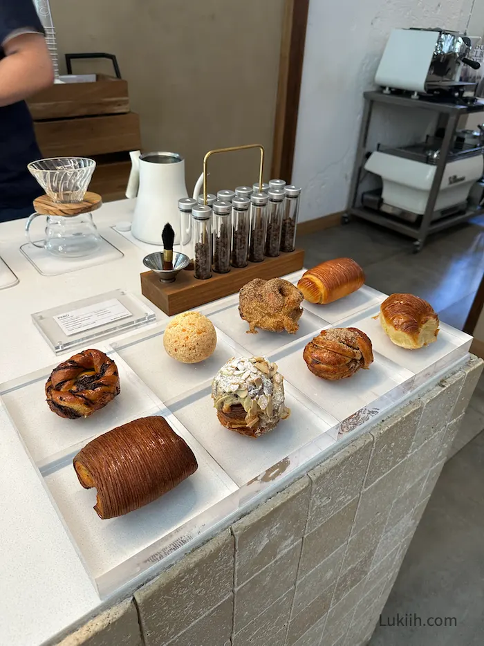 A set of pastries laid out on a modern display.